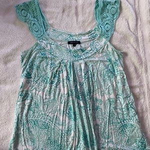 Listed is a really cute sleeveless top from AK Anne Klein in a Small
